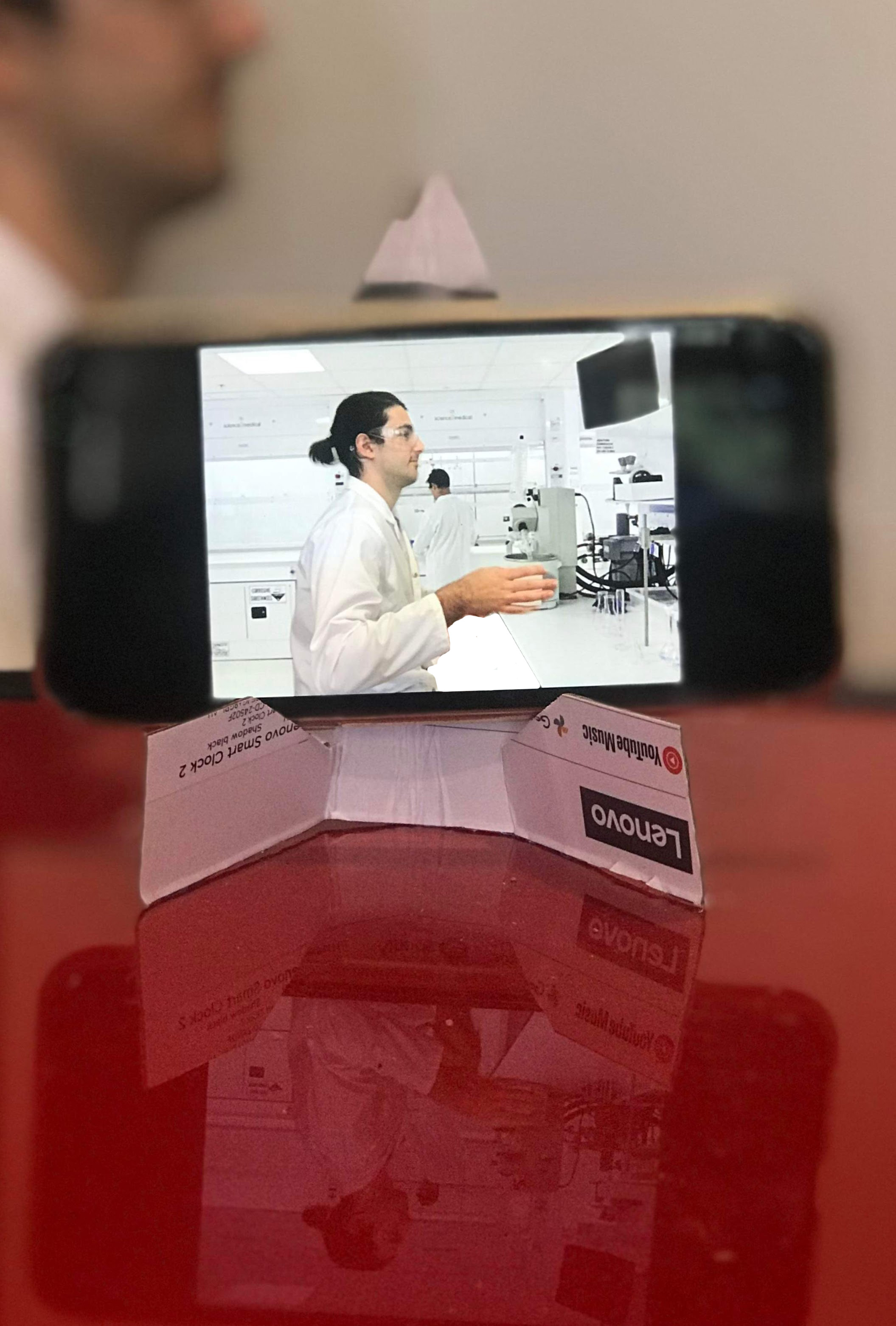 iphone on cardboard stand